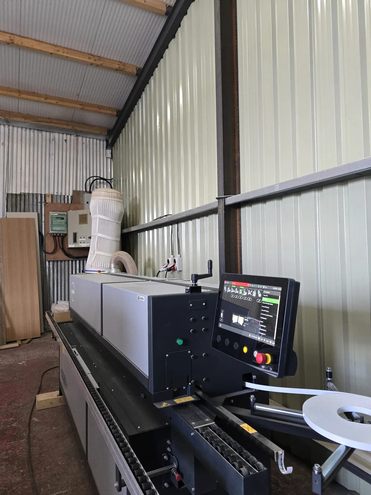 Professional edge banding machinery used during fitted furniture production